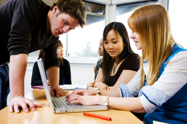 students working on computer